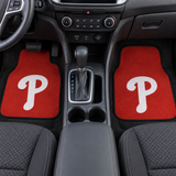 Two red car floor mats with white 'P' logo on a white background