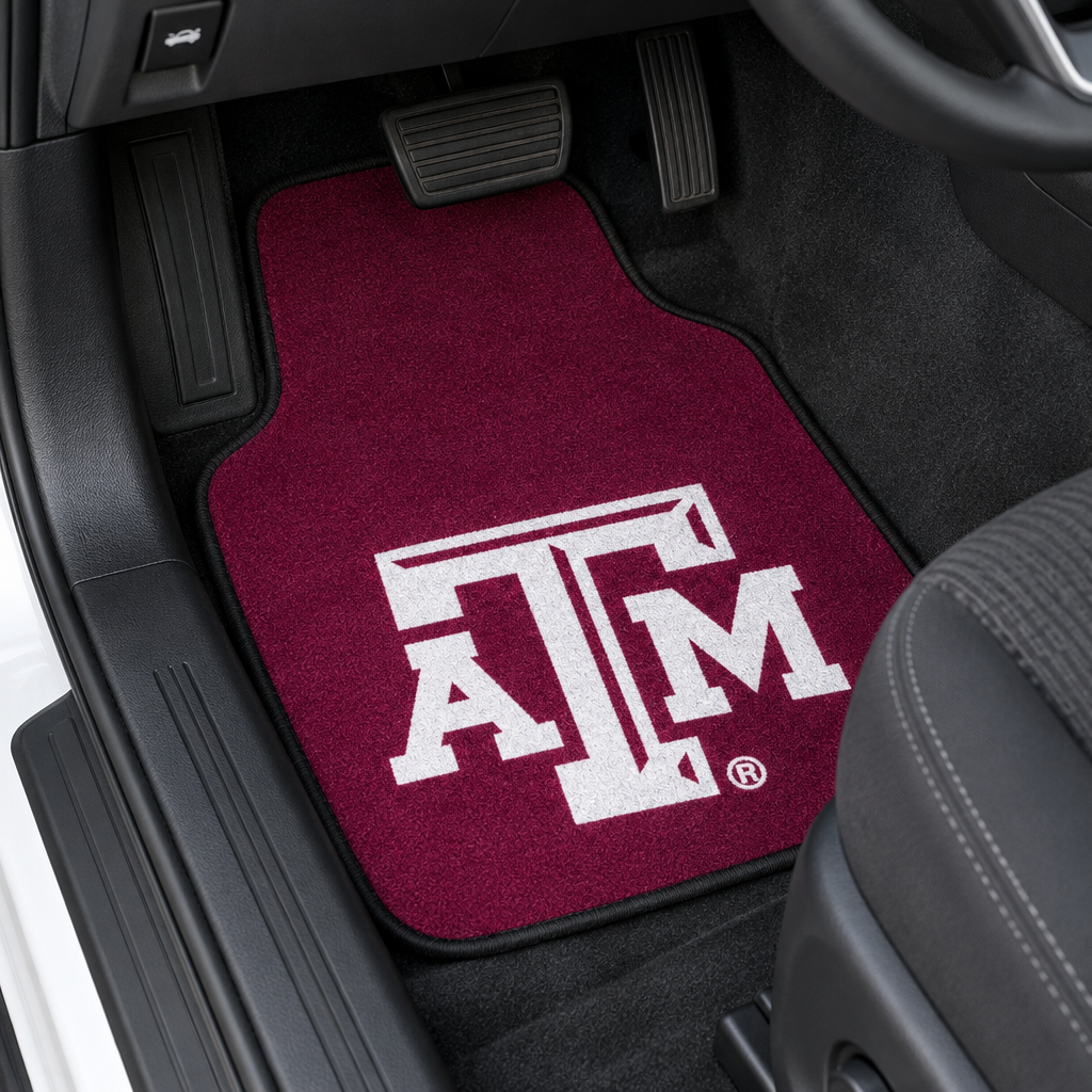 Two maroon car floor mats with white 'ATM' logo on a white background
