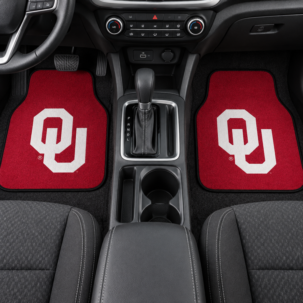 Two red car mats with a white 'OU' logo on a white background