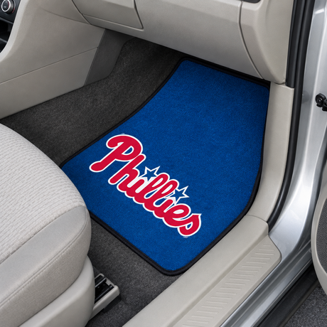 Car floor mat with Phillies logo on a car interior
